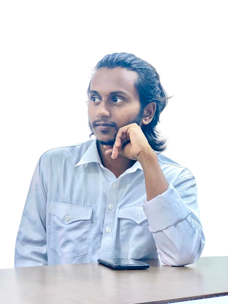 Nayem sitting thoughtfully at a desk
